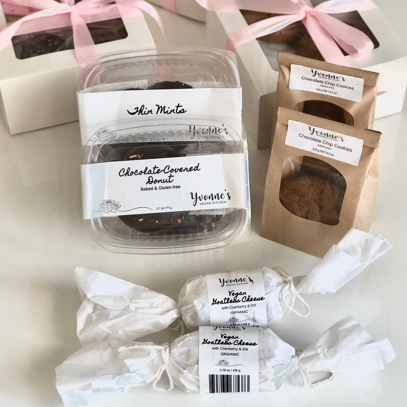 An assortment of Yvonne's Vegan Kitchen products, including cookies, donuts, and vegan cheese.