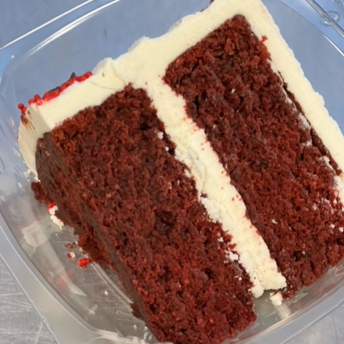 Slice of Red Velvet Cake with Cream Cheese Frosting